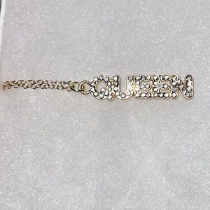 “QUEEN” 16 inch metallic gold necklace